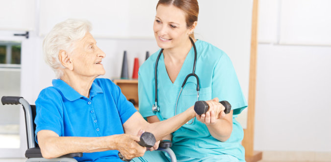 a nurse helping her patient exercise