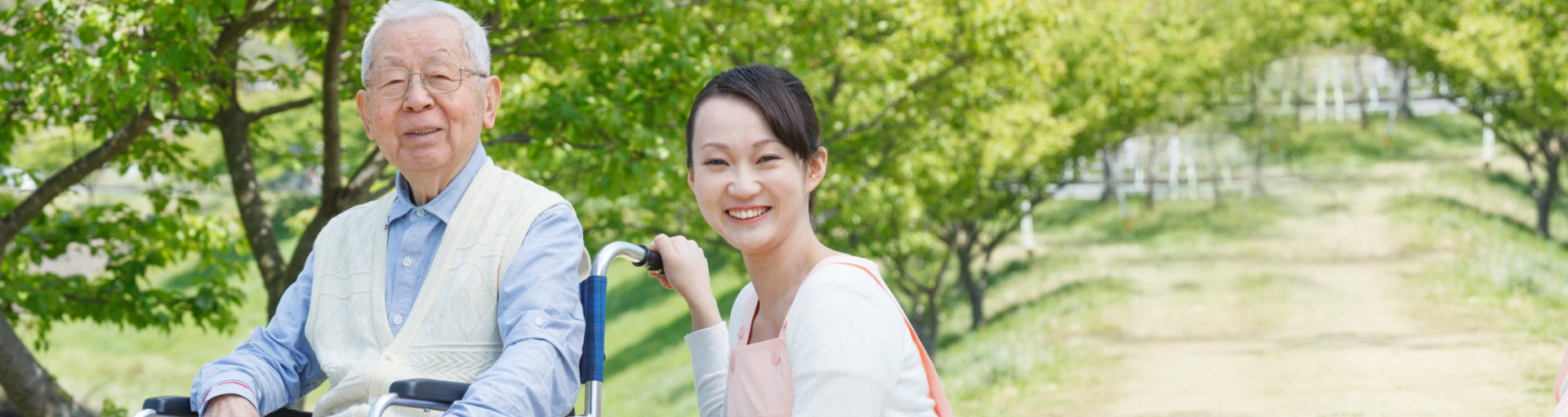 a nurse walking on a park with her patient